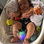 Léo participe au concours pour gagner de l'argent avec cette photo : baby, bathtub, water, toy, blocks, splash, child, indoor, play, fun, wet, light, colorful, infant, bath, smile, relax, towel, floor, cute