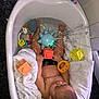 baby, bathtub, water, toy, splash, child, bath, towel, colorful, sitting, relaxing, indoors, floor, plastic, block, octopus_toy, cute, skin, head, hand