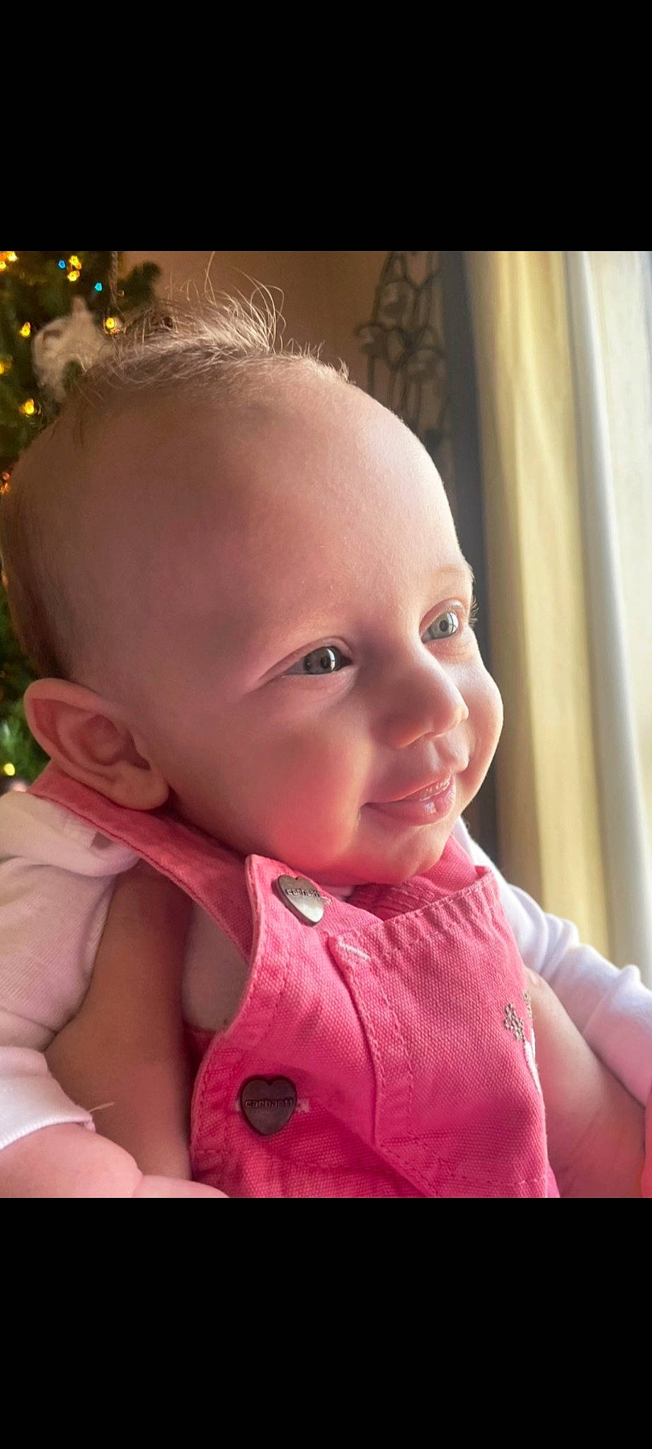 Lilyana is registered to the contest to win money with this photo: baby, baby_toddler_clothing, cheek, ear, eye, eyelash, finger, gesture, hand, happy, head, iris, lip, mouth, nose, person, pink, skin, sleeve, smile