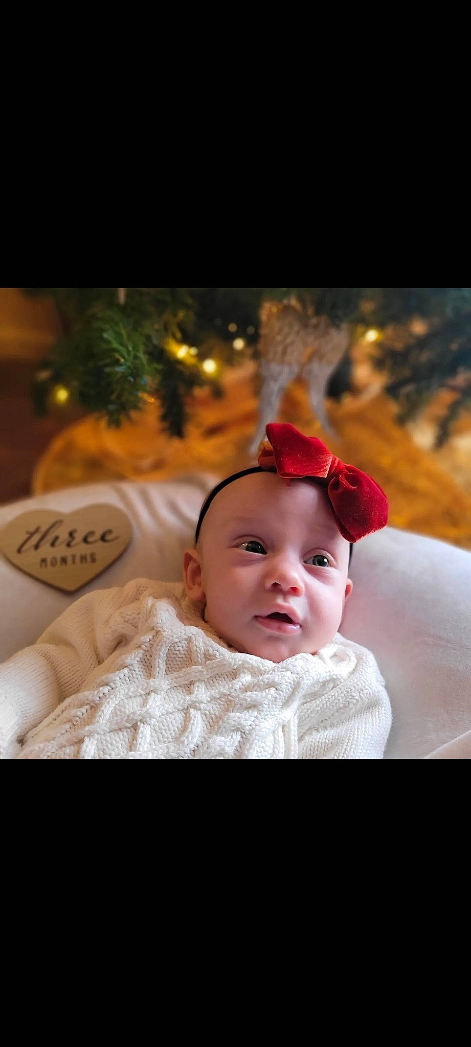 Lilyana is registered to the contest to win money with this photo: baby, baby_toddler_clothing, child, christmas, christmas_decoration, comfort, costume_hat, event, eye, face, flash_photography, fun, fur, happy, headwear, holiday, ornament, person, portrait_photography, sitting