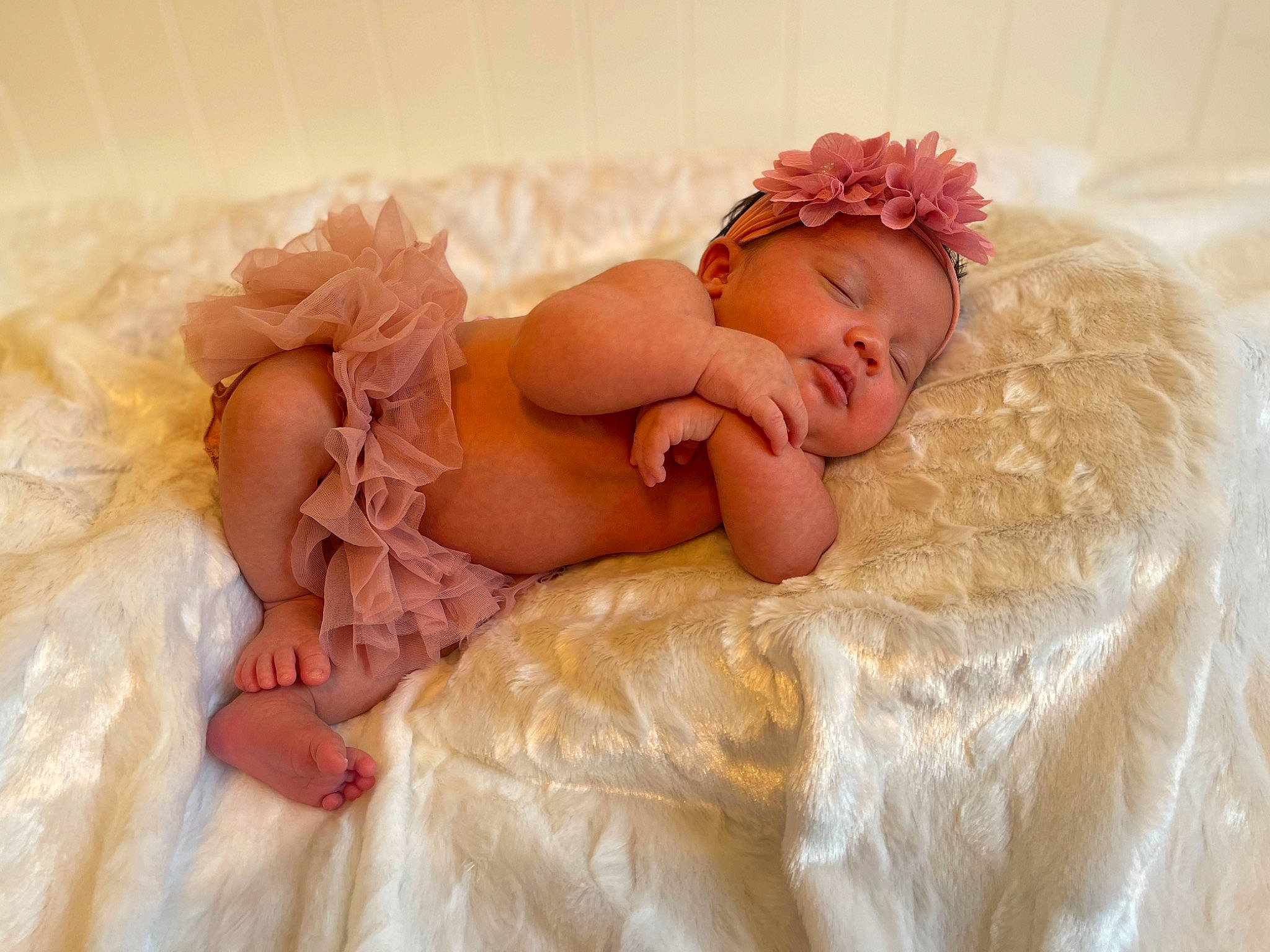 Kinley joined the competition — help win amazing prizes! baby, baby_sleeping, baby_toddler_clothing, comfort, couch, embellishment, eye, fashion_accessory, flooring, fur, hair_accessory, head, headband, headgear, headpiece, headwear, jewellery, linens, peach, person