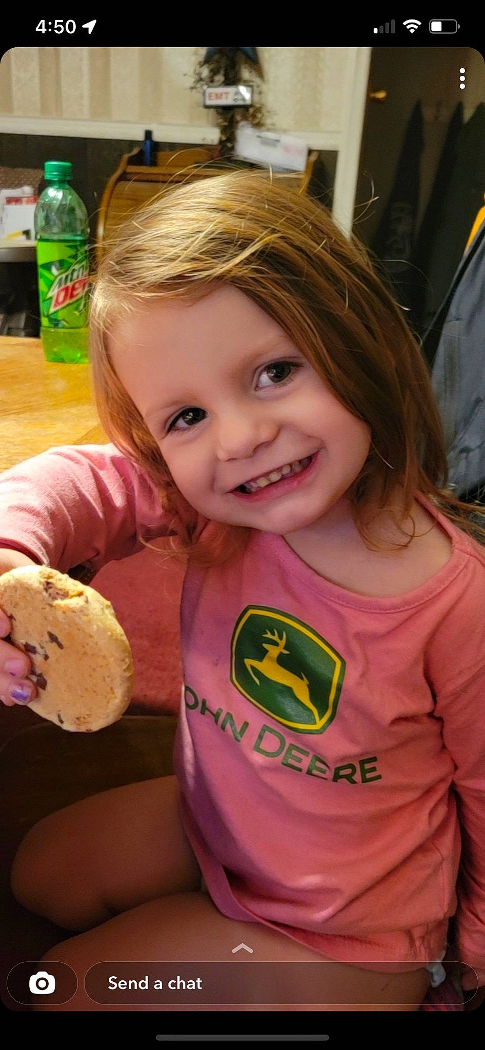 Arabella is registered to the contest to win money with this photo: blond, bottle, cheek, child, dessert, finger, food, fun, hairstyle, happy, head, iris, joy, person, pink, product, skin, sleeve, smile, summer