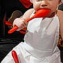 baby, child, chef_hat, apron, kitchen, red_spatula, whisk, bowl, flour, cooking, baking, playful, cute, indoors, person, face, hands, blue_eyes, white_clothing, food_preparation