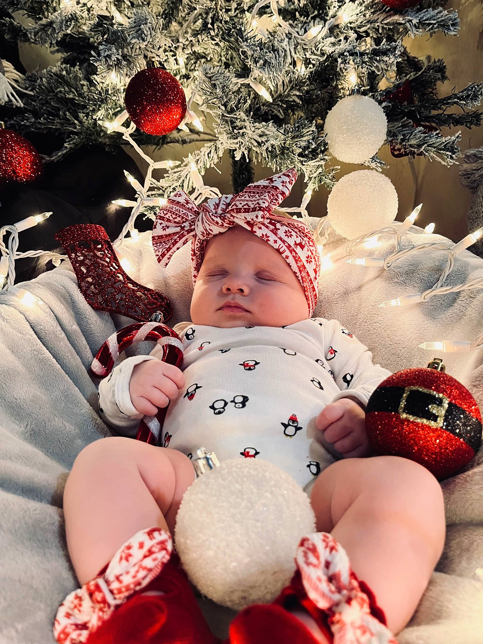 Eden is registered to the contest to win money with this photo: baby, baby_sleeping, baby_toddler_clothing, carmine, child, event, facial_expression, happy, headgear, headwear, holiday, light, pattern, people_in_nature, person, pink, product, red, textile, thigh