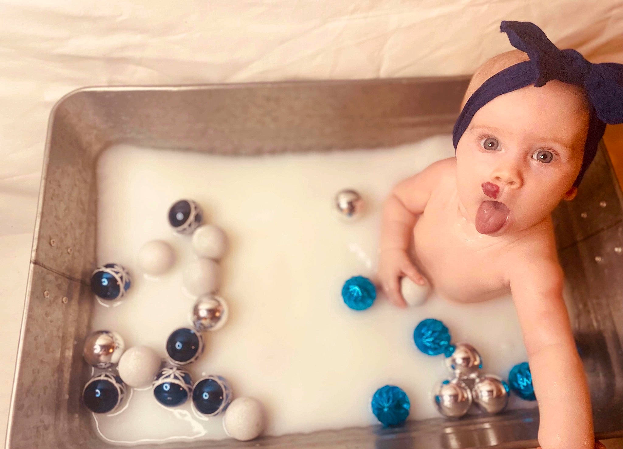 Norah joined the competition — help win amazing prizes! baby, bathing, bathroom, bathtub, chest, circle, eyelash, fashion_accessory, finger, fluid, leisure, liquid, person, plumbing, plumbing_fixture, tap, thumb, toddler, toy, water