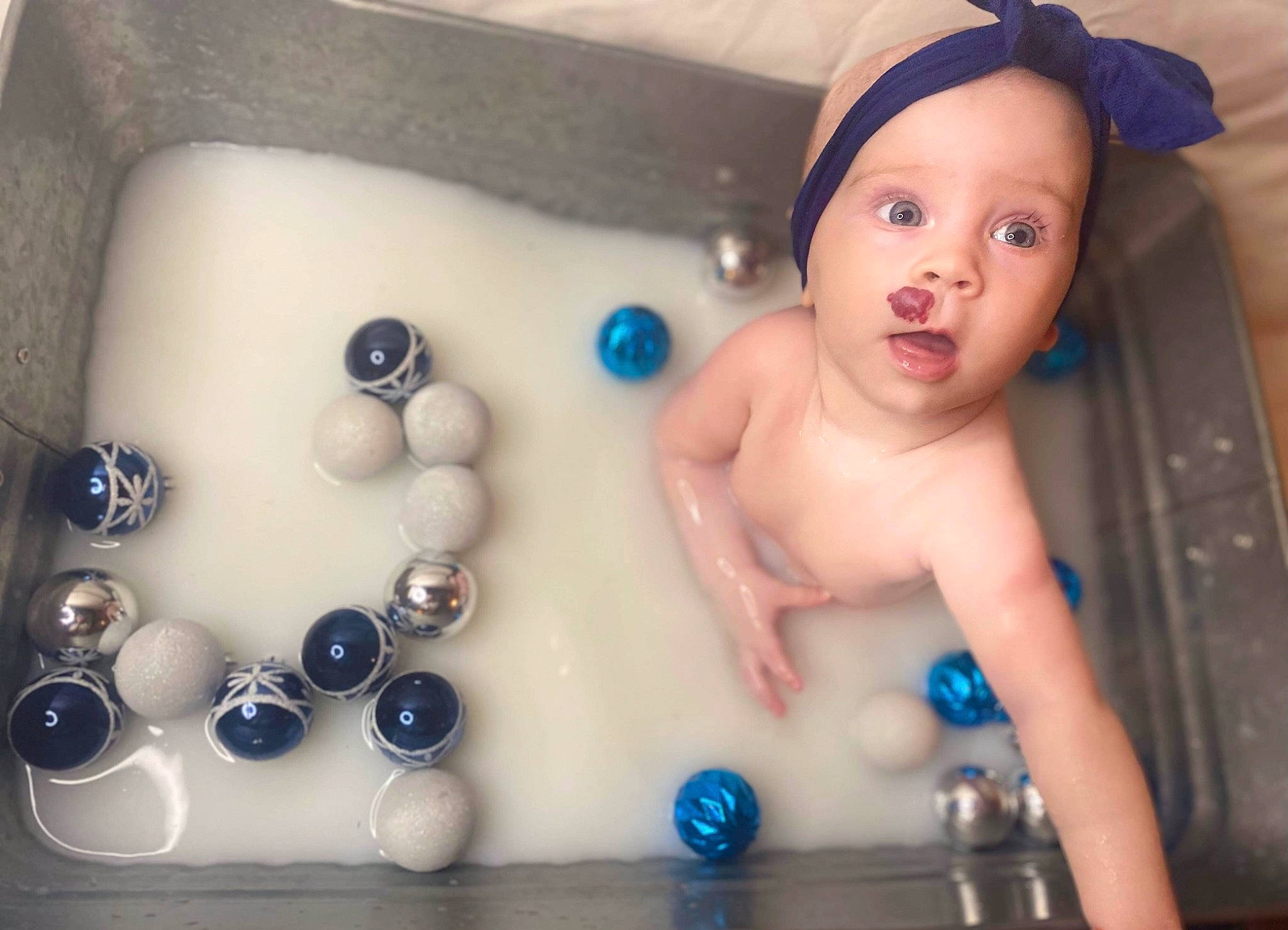 Norah joined the competition — help win amazing prizes! baby, baby_bathing, baby_products, bathing, bathroom, bathtub, blue, cap, chest, child, electric_blue, fashion_accessory, fun, happy, person, plumbing_fixture, rectangle, room, surprise, tap
