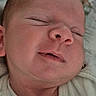 baby, child, chubby_cheeks, closeup, cute, face, head, indoors, infant, mouth, newborn, nose, onesie, peaceful, person, portrait, resting, skin, sleeping, soft