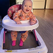 Aurora joined the competition — help win amazing prizes! baby, walker, smiling, indoor, floor, clothing, pink_socks, television, washing_machine, furniture, happy, child, infant, seat, toy, room, casual, cute, person, home