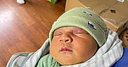 Tayo joined the competition — help win amazing prizes! baby, newborn, sleeping, blanket, hat, clothing, person, indoor, wooden_floor, box, pajamas, footwear, sleep, cute, infant, rest, cozy, wrapped, child, home