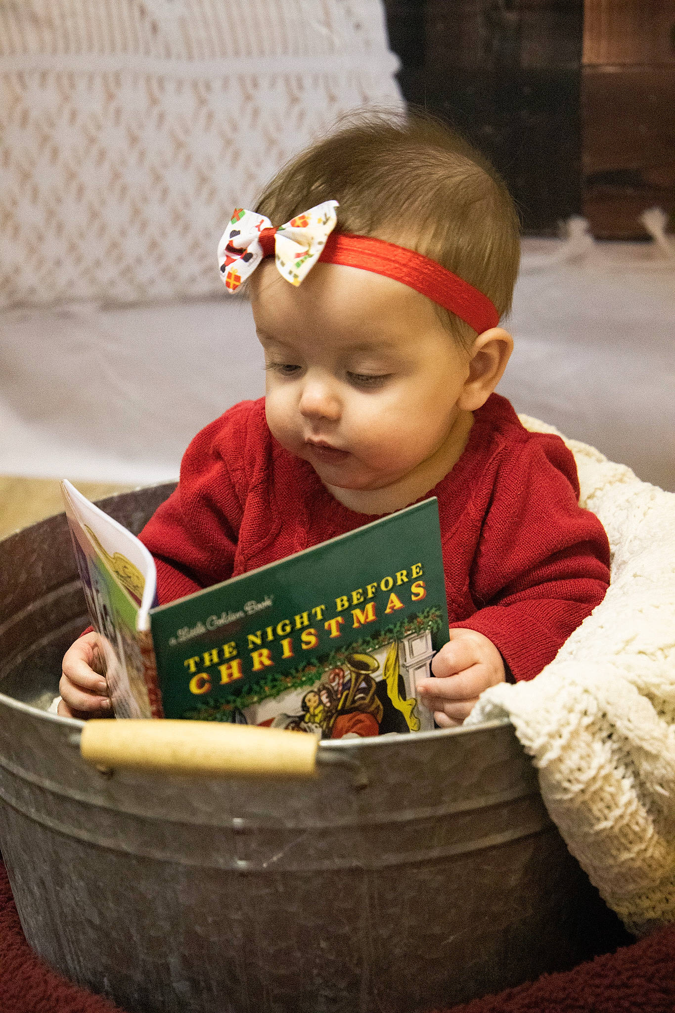 Ava joined the competition — help win amazing prizes! baby, baby_products, baby_toddler_clothing, basket, child, christmas, christmas_eve, event, eye, fun, happy, head, holiday, person, present, reading, room, sitting, storage_basket, toddler