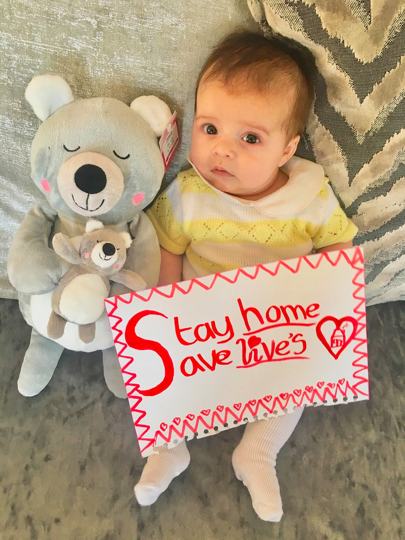 Paul-junior Scott Williams is registered to the contest to win money with this photo: baby, child, happy, hug, love, person, pink, plush, product, red, smile, stuffed_toy, teddy_bear, textile, toddler, toy