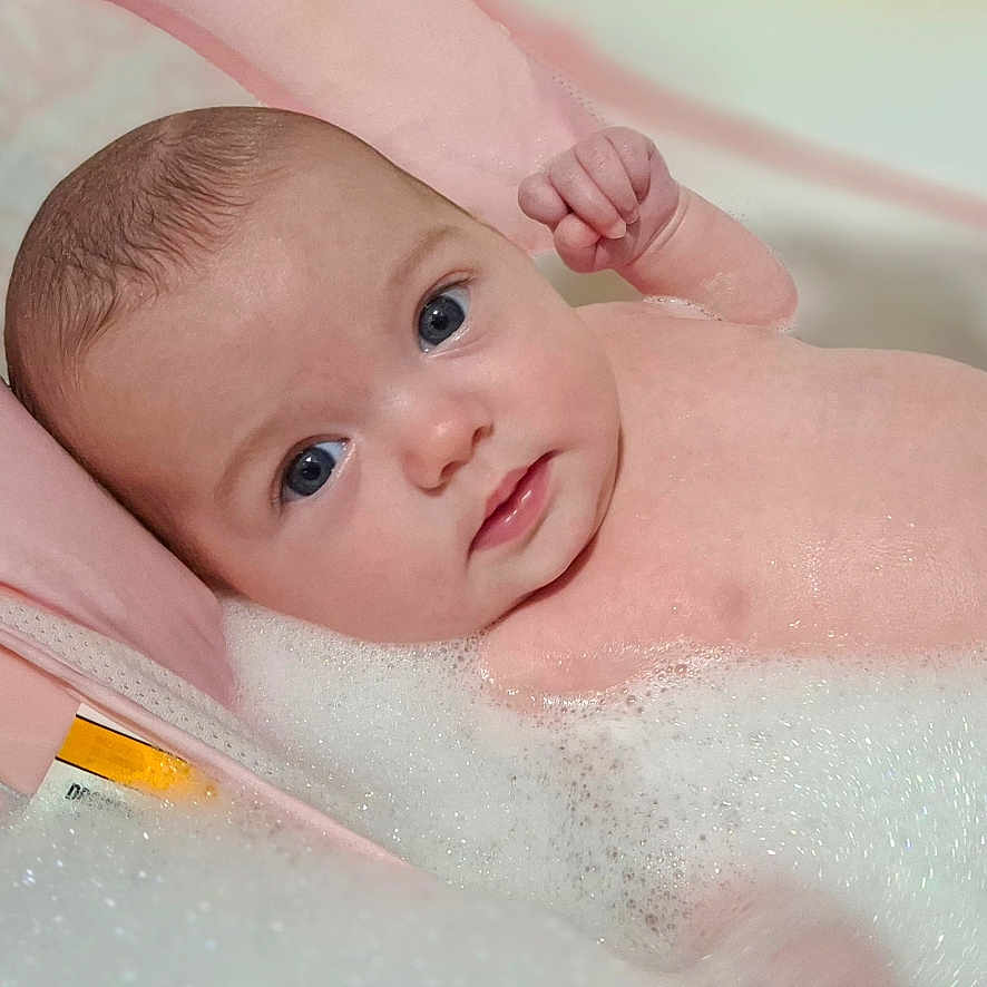 Alanna joined the competition — help win amazing prizes! baby, bath, blue_eyes, bubbles, child, clean, comfort, cute, face, foam, indoors, infant, pink_bath_support, portrait, relaxing, skin, tub, water, wet, young