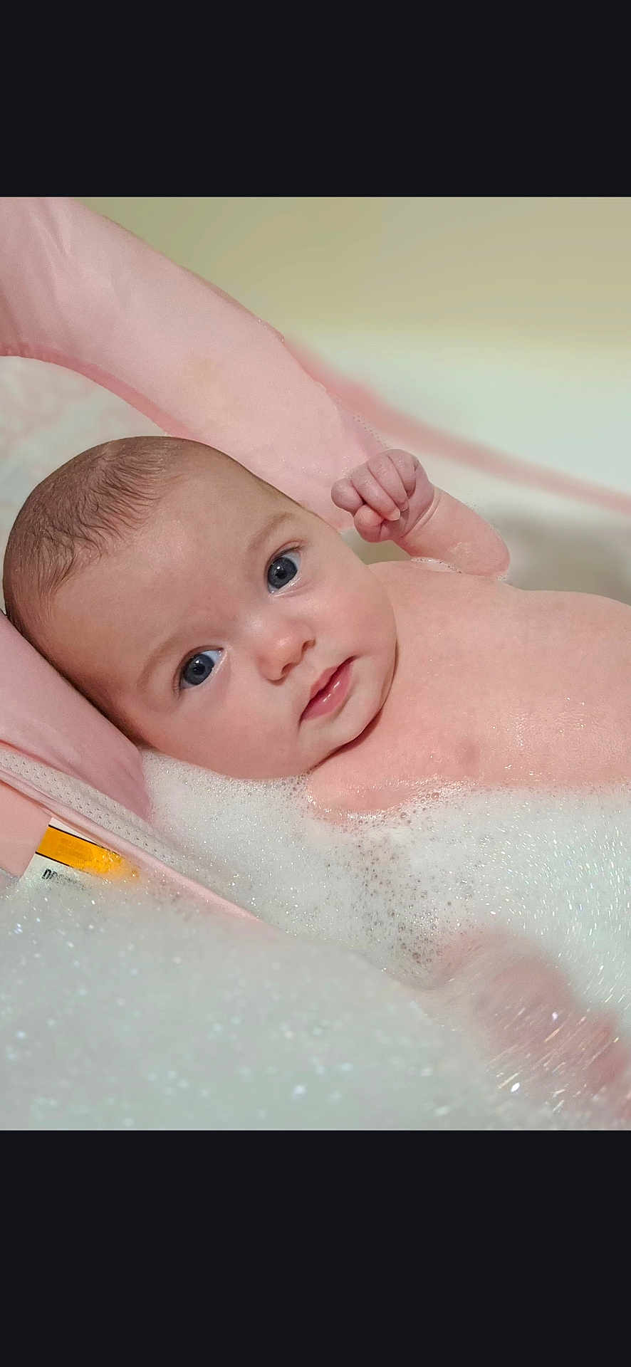 Alanna joined the competition — help win amazing prizes! baby, bath, blue_eyes, bubbles, child, clean, comfort, cute, face, foam, indoors, infant, pink_bath_support, portrait, relaxing, skin, tub, water, wet, young