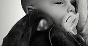 Gianni is registered to the contest to win money with this photo: baby, biting, bodypart, ear, face, finger, hand, head, neck, newborn, person, photography, portrait