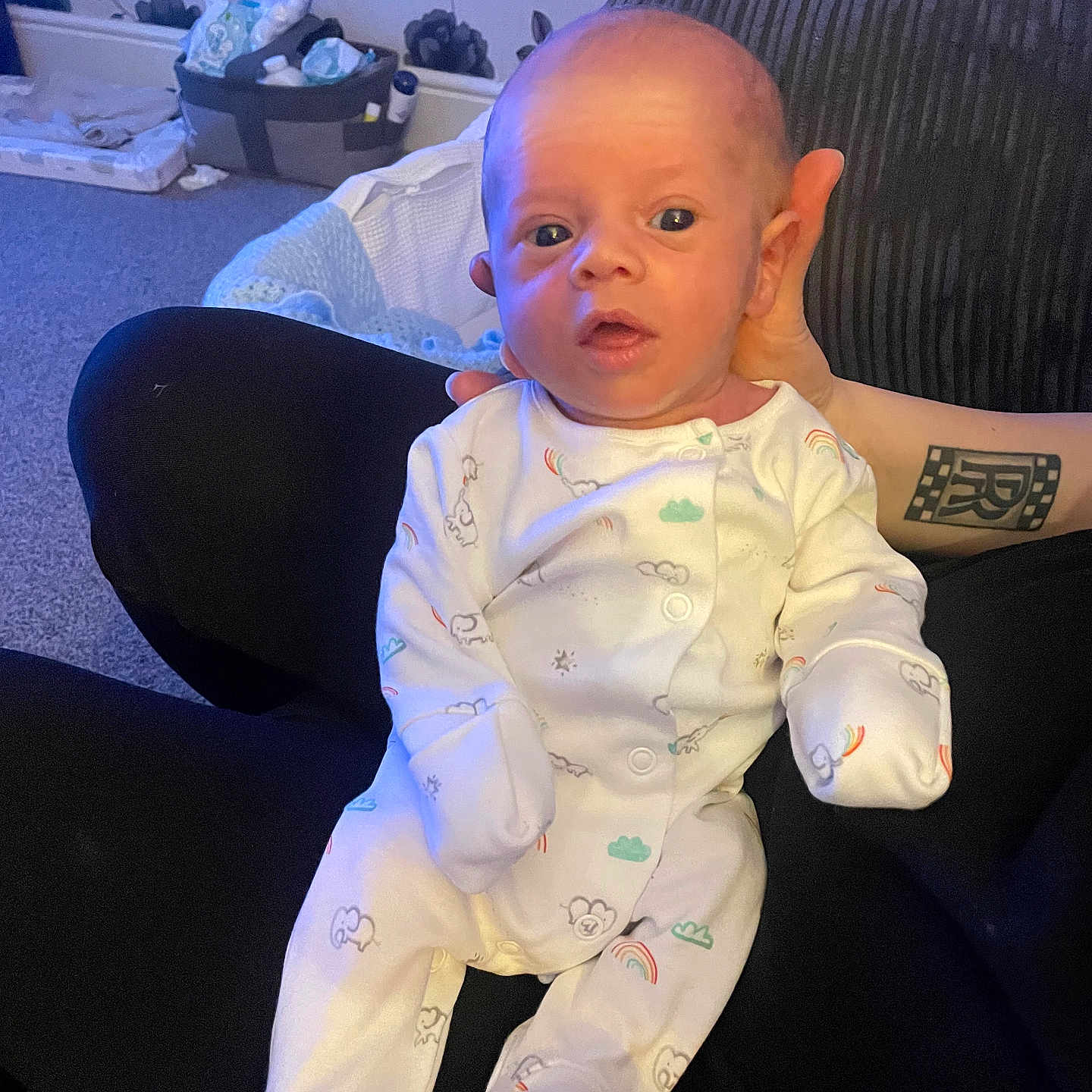 Jax is registered to the contest to win money with this photo: baby, bodypart, box, chair, clothing, couch, cushion, face, finger, furniture, hand, head, homedecor, newborn, pajamas, pants, person, photography, portrait, sitting