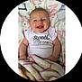 Ellie joined the competition — help win amazing prizes! baby, bed, blanket, bodypart, clothing, cushion, face, furniture, happy, head, homedecor, laughing, newborn, person, photography, portrait, quilt, sitting, smile, t_shirt
