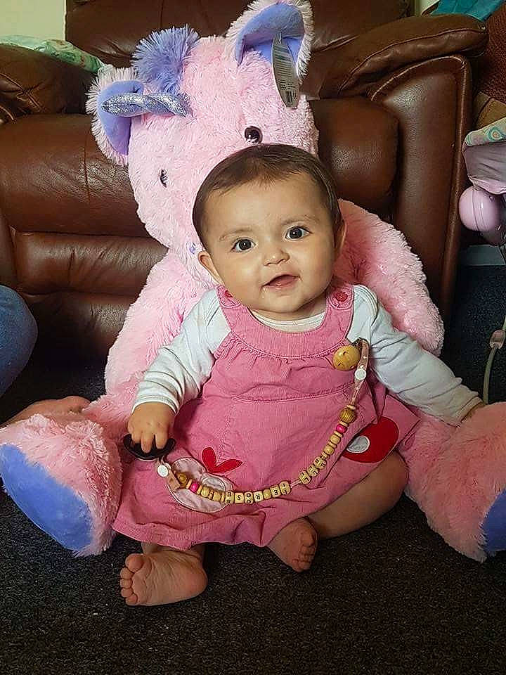 Ellie-rose is registered to the contest to win money with this photo: child, doll, human_positions, infant, person, pink, skin, toddler, toy