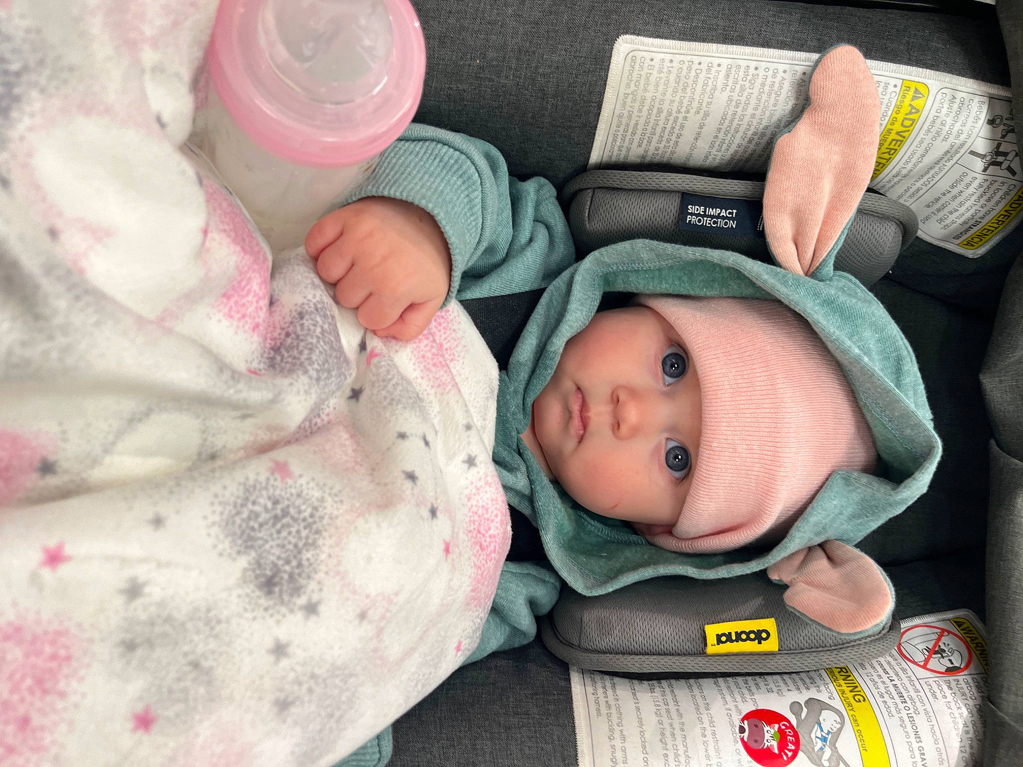 Coraline is registered to the contest to win money with this photo: baby, baby_carriage, baby_products, baby_safety, baby_sleeping, baby_toddler_clothing, cheek, child, comfort, eye, face, hand, headwear, human_body, linens, person, product, room, skin, sleep