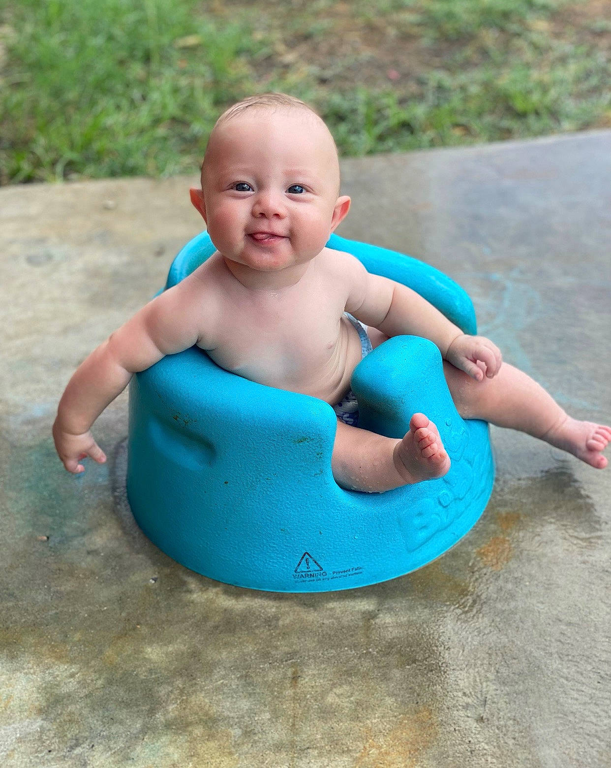 Anthony is registered to the contest to win money with this photo: baby, baby_products, baby_toddler_clothing, bathing, cheek, chest, child, circle, electric_blue, finger, fun, grass, happy, joy, leisure, mammal, person, plastic, sitting, smile