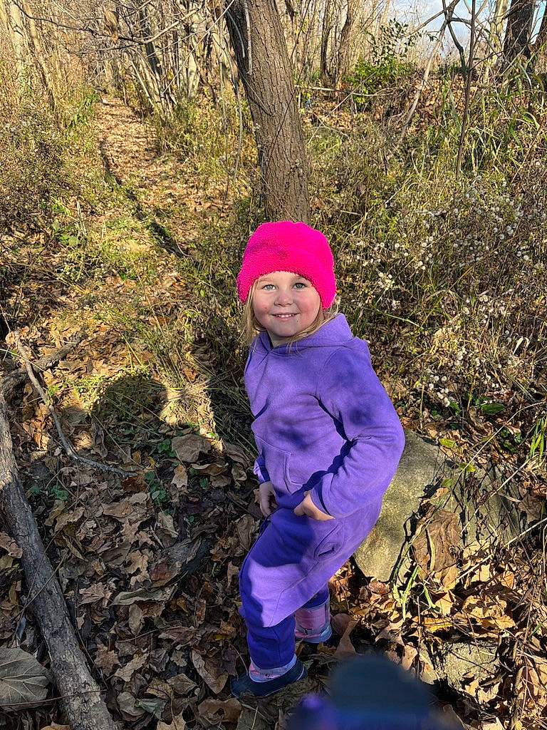 Keirra is registered to the contest to win money with this photo: electric_blue, forest, grass, happy, hat, headwear, jacket, joy, landscape, leisure, natural_landscape, people_in_nature, person, plant, recreation, smile, soil, toddler, tree, wilderness