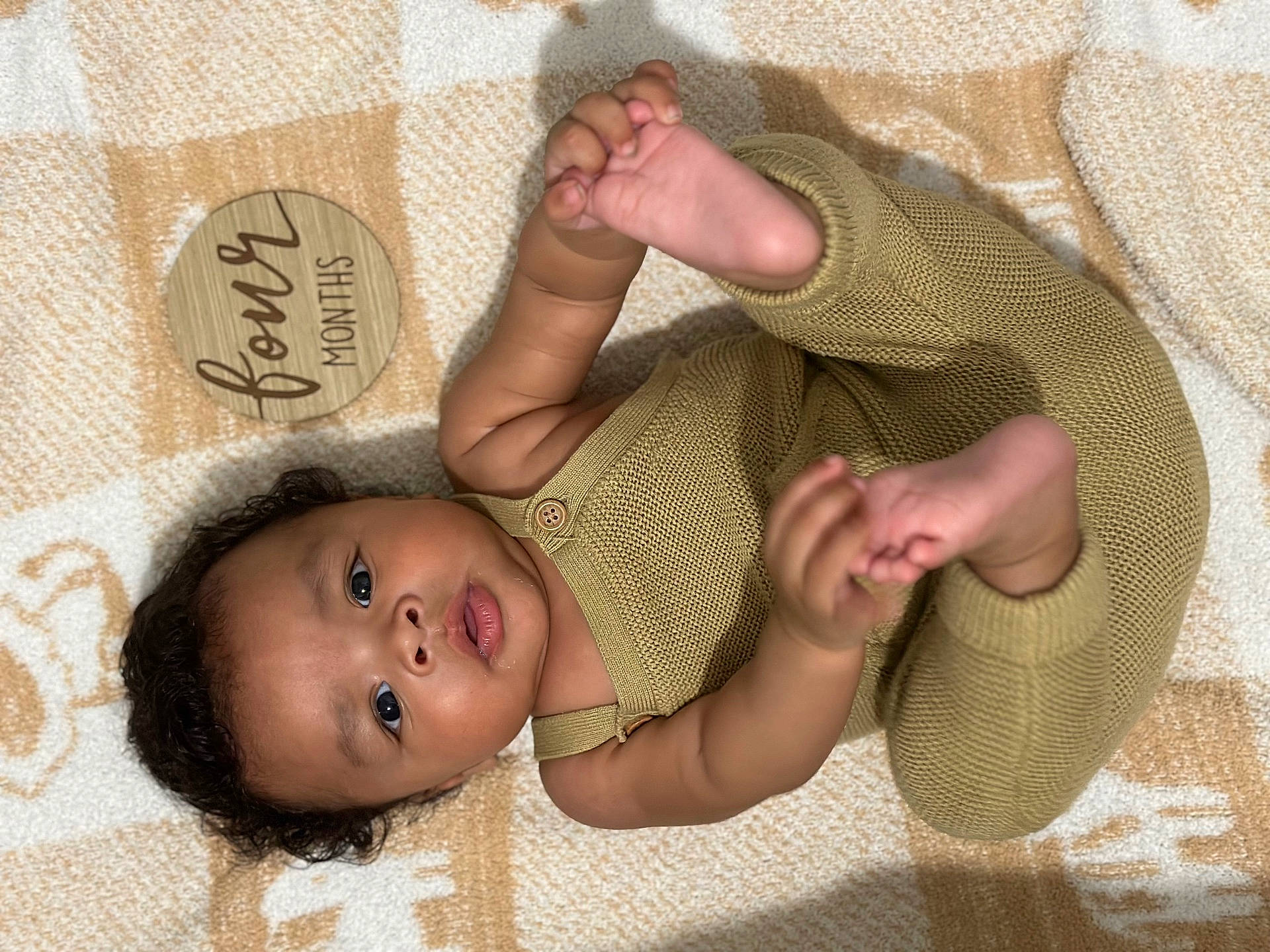 Emilio is registered to the contest to win money with this photo: baby, blanket, bodypart, clothing, face, finger, hand, happy, head, homedecor, knitwear, newborn, pants, person, photography, portrait, sleeve, smile, sweater, toe