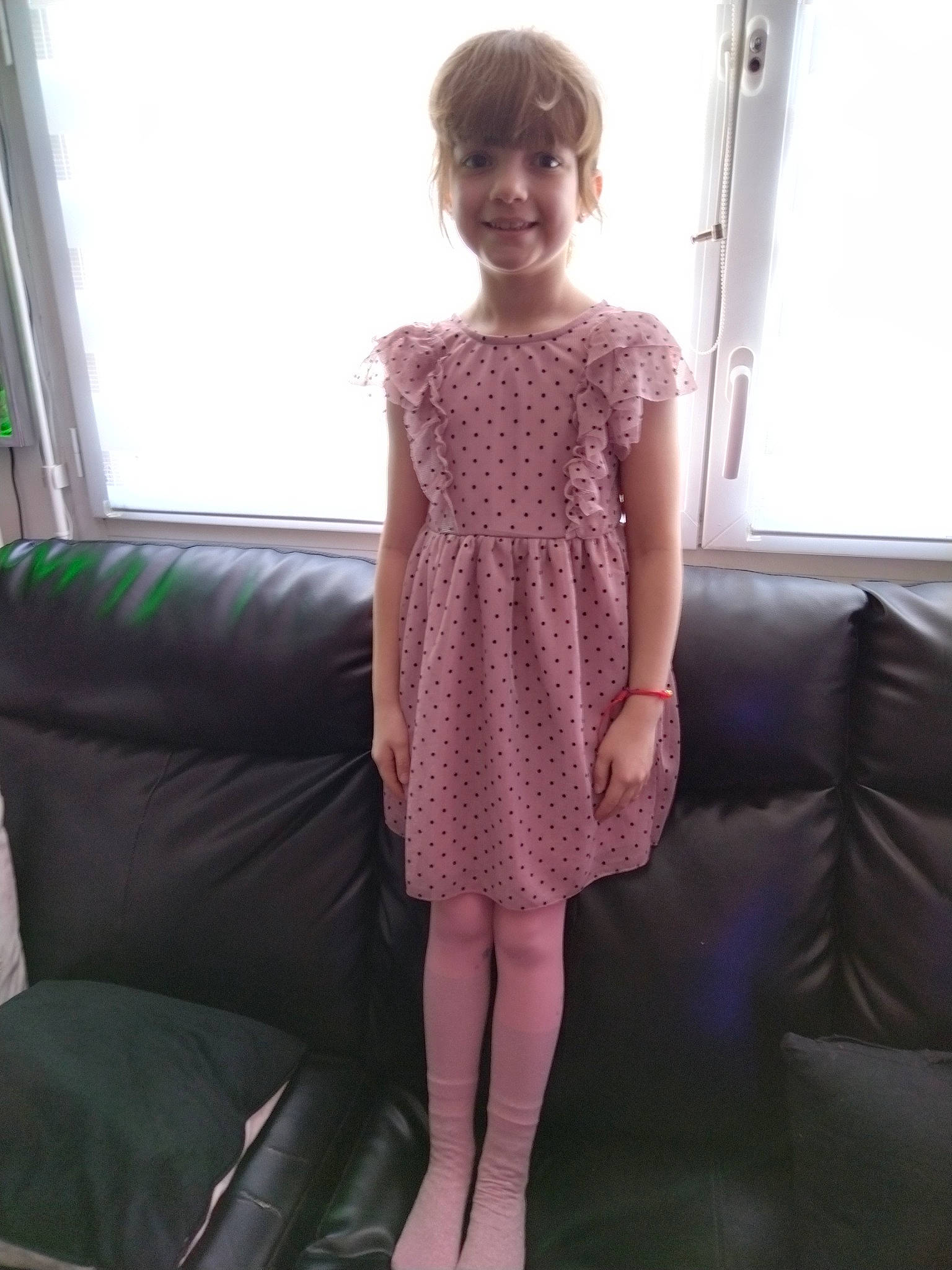Rosalie participe au concours pour gagner de l'argent avec cette photo : arm, comfort, couch, day_dress, dress, embellishment, fashion, furniture, joint, joy, knee, lip, magenta, neck, person, shoulder, skin, sleeve, smile, thigh