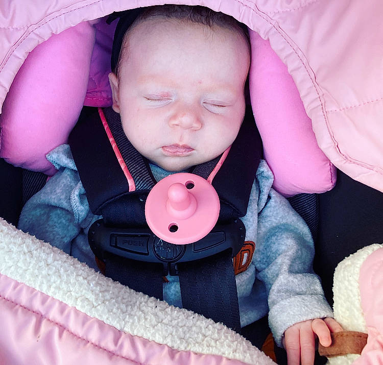 Emiliana joined the competition — help win amazing prizes! baby, baby_carriage, baby_safety, baby_toddler_clothing, cheek, comfort, eye, eyelash, iris, lip, neck, nose, organ, outerwear, person, pink, product, skin, sleeve, textile