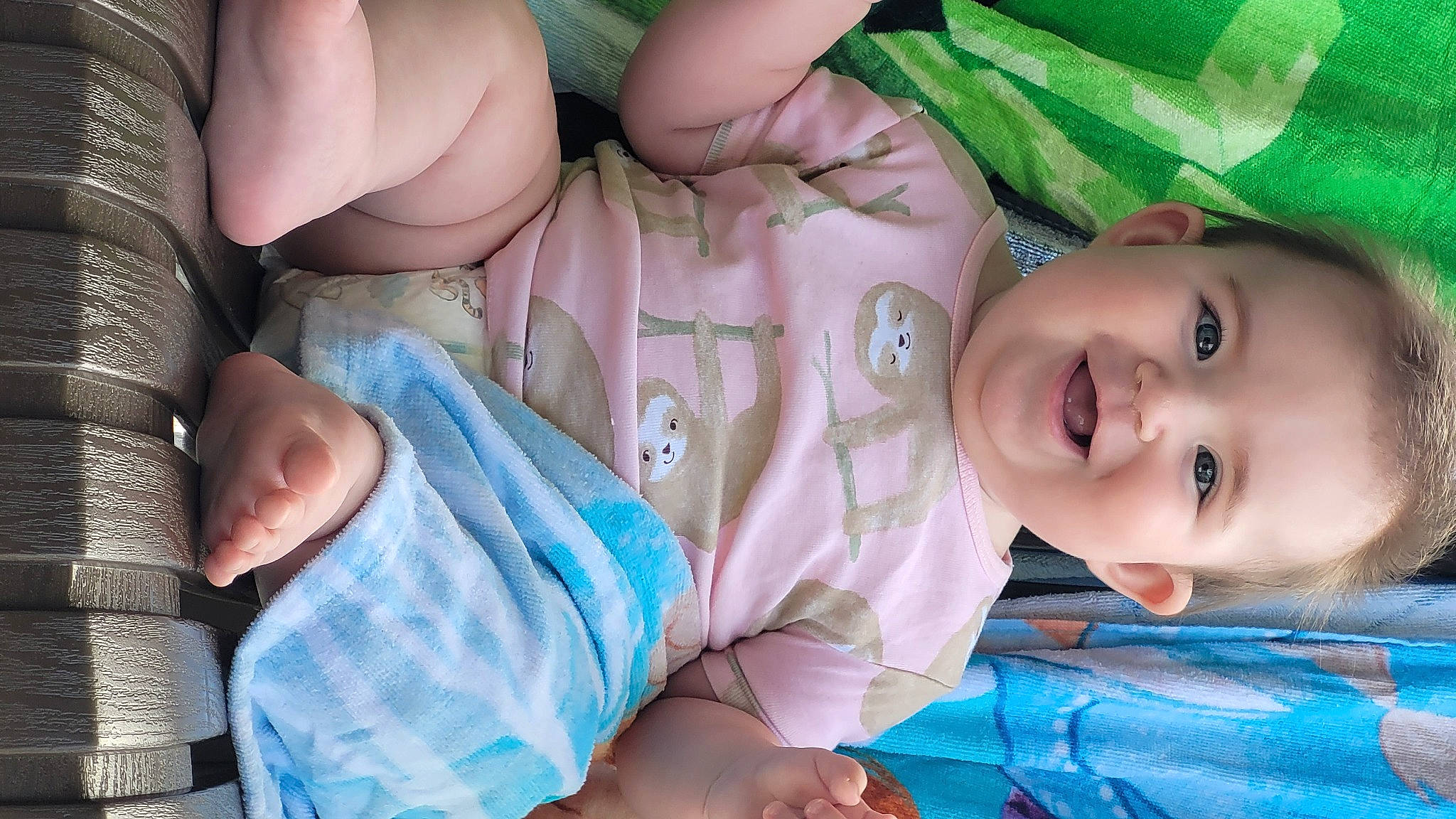 Tatehanna is registered to the contest to win money with this photo: arm, baby, baby_toddler_clothing, cheek, eye, face, facial_expression, green, hand, head, human, human_body, iris, joy, leg, mouth, nose, organ, person, product