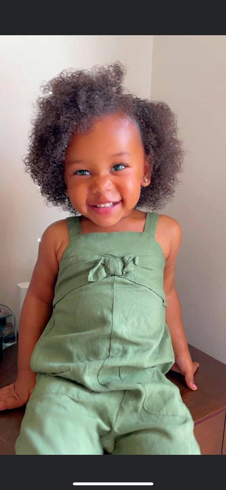 Kaycen is registered to the contest to win money with this photo: arm, baby_toddler_clothing, cheek, eye, eyelash, face, facial_expression, hair, hairstyle, head, human_body, joy, lip, neck, organ, person, shoulder, skin, sleeve, smile