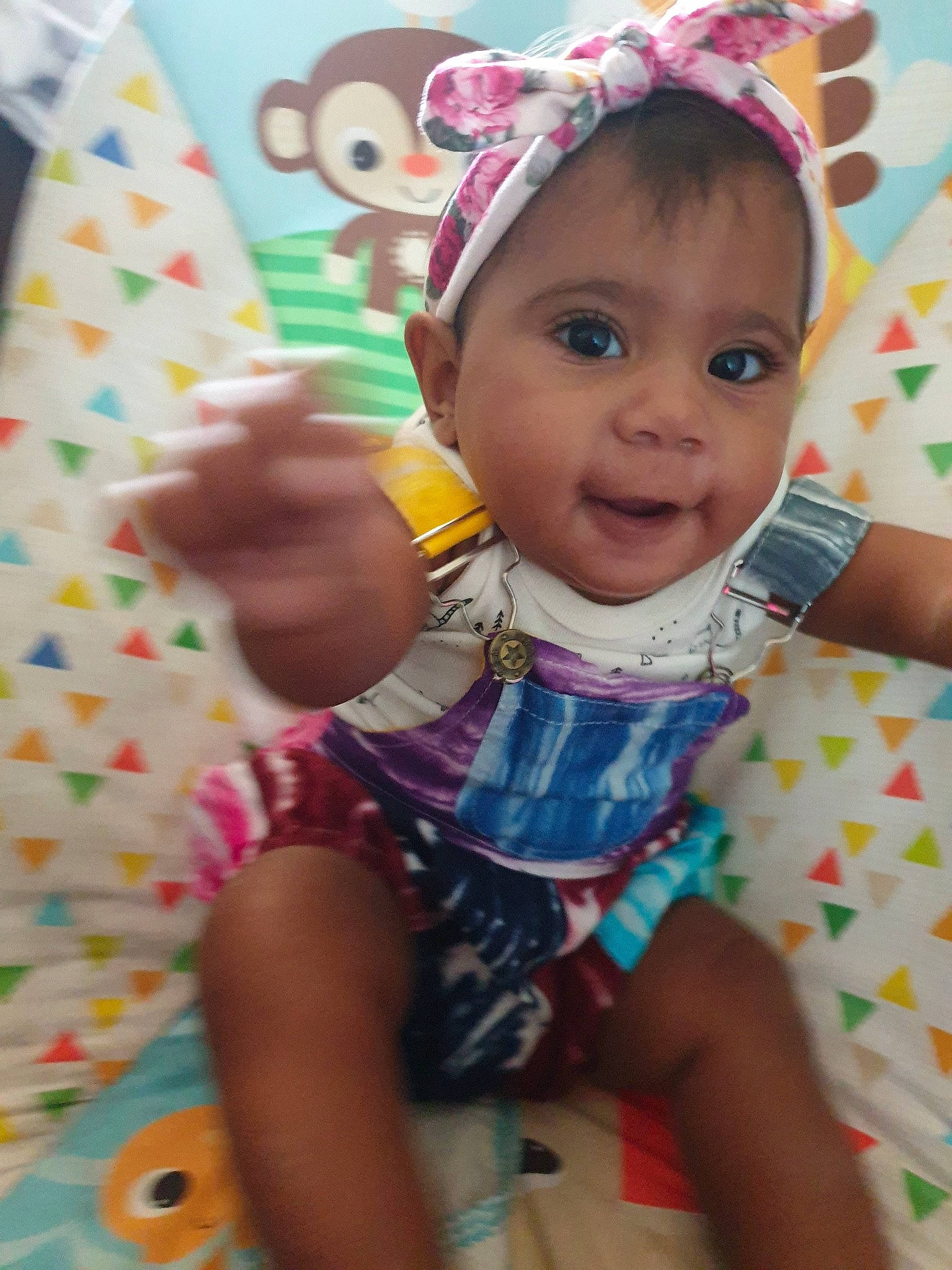 Brazil is registered to the contest to win money with this photo: baby, baby_products, baby_toddler_clothing, cheek, child, hair_accessory, happy, head, headgear, person, pink, play, skin, smile, toddler