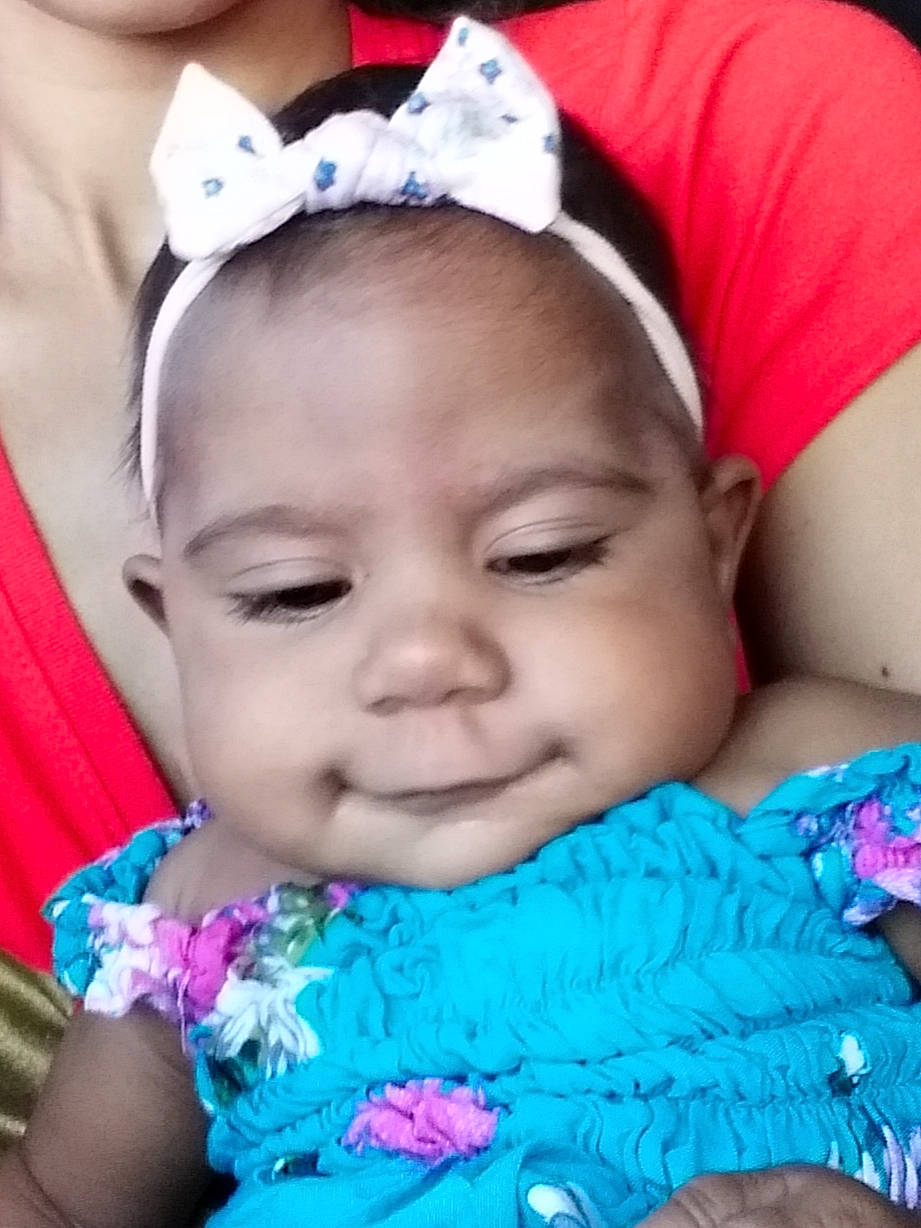 Brazil is registered to the contest to win money with this photo: baby, beauty, cheek, child, eyebrow, face, fashion_accessory, forehead, hair_accessory, happy, head, headband, headgear, joy, lip, mouth, nose, person, pink, skin