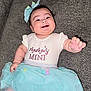baby, bow, celebration, child, clothing, couch, cute, cute_expression, dress, fabric, fun, happy, indoor, infant, person, portrait, sitting, smiling, soft, tutu