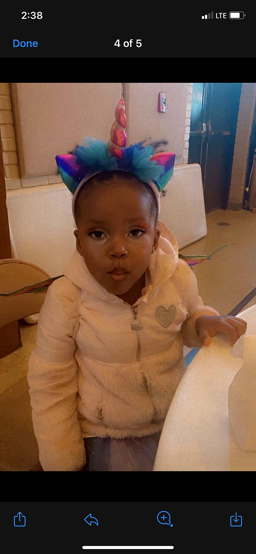 Arianna is registered to the contest to win money with this photo: baby, birthday, chair, child, costume_accessory, costume_hat, crown, fashion_accessory, flooring, fun, hair_accessory, happy, headband, headpiece, party_hat, party_supply, person, room, sitting, toddler