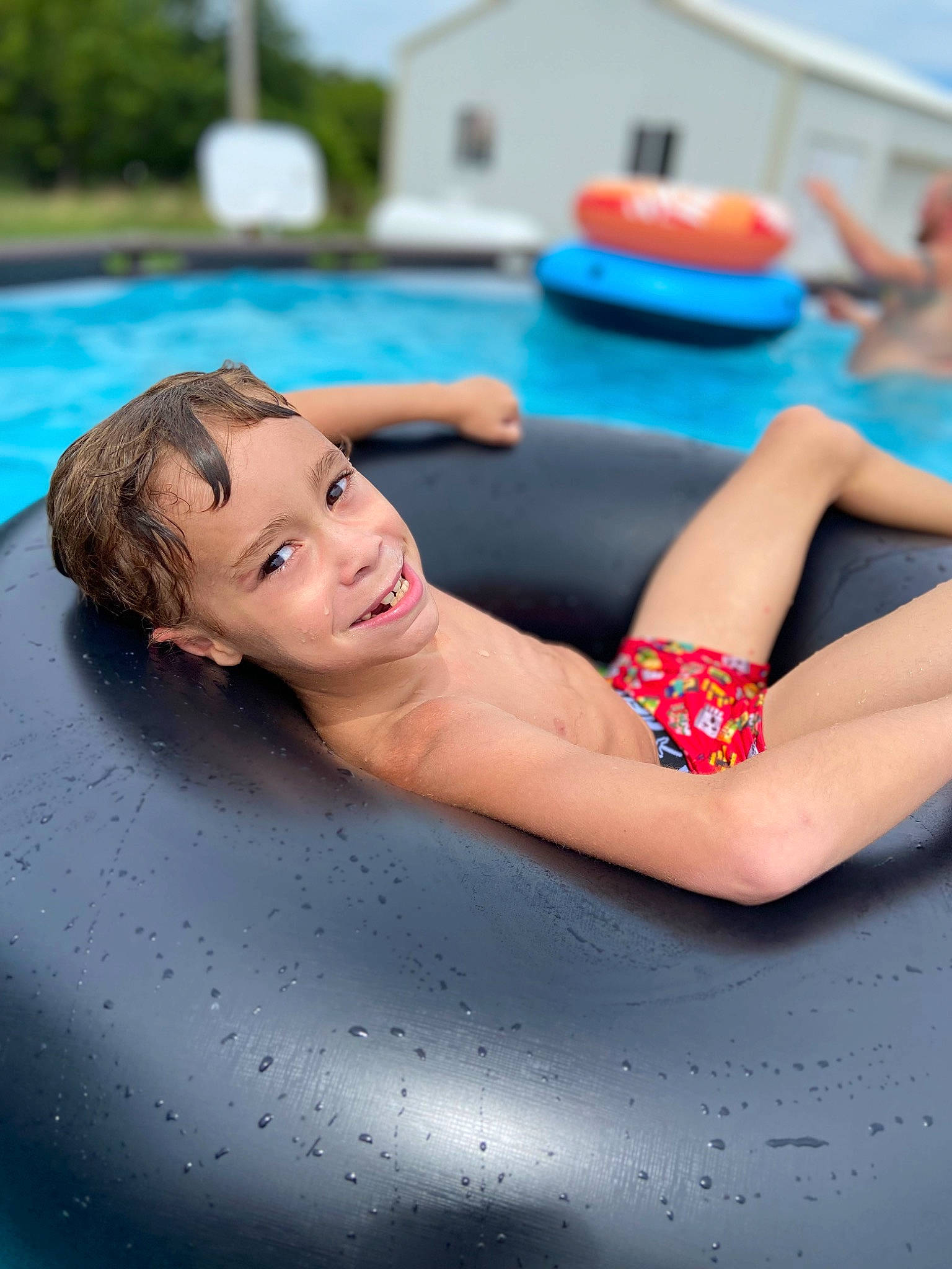 Denver is registered to the contest to win money with this photo: barefoot, bathing, blue, chest, electric_blue, foot, fun, happy, human_leg, indoor_games_and_sports, joint, joy, leisure, person, recreation, sitting, sky, swimming_pool, swimwear, thigh