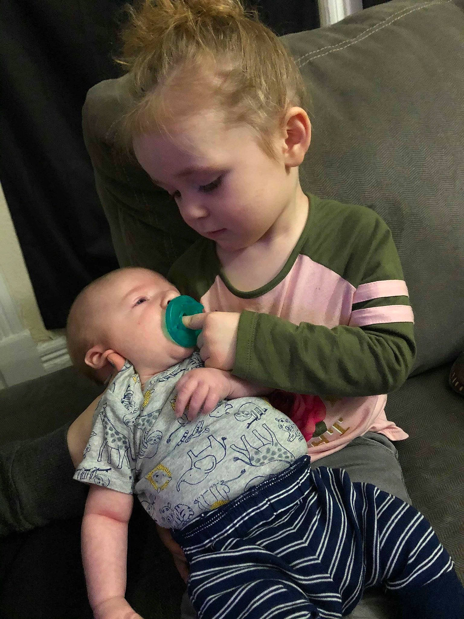 Grace Lee is registered to the contest to win money with this photo: arm, baby, cheek, child, ear, interaction, leg, mother, nose, person, sitting, skin, toddler