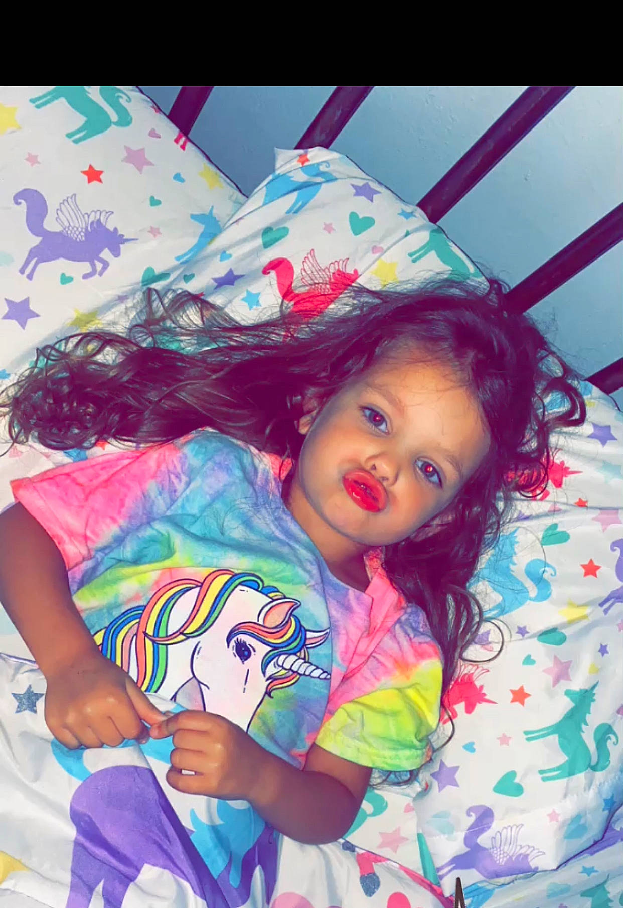 Josie is registered to the contest to win money with this photo: baby_toddler_clothing, beauty, child, design, eyelash, facial_expression, fashion_accessory, fun, happy, lip, magenta, mouth, pattern, person, photograph, pink, play, purple, sitting, textile