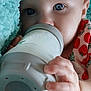 Ember joined the competition — help win amazing prizes! baby, bottle, milk, blanket, blue_eyes, hand, feeding, infant, strawberry_pattern, soft_texture, close_up, cute, child, toddler, portrait, sleepwear, comfort, cozy, resting, nursery