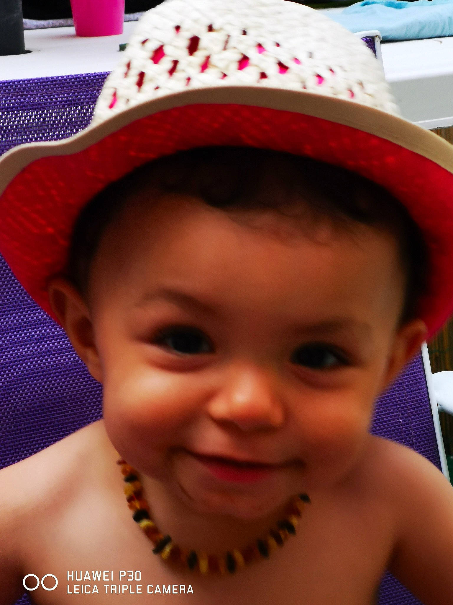 Maëlle participe au concours pour gagner de l'argent avec cette photo : baby, cheek, child, facial_expression, fashion_accessory, fun, happy, hat, head, headgear, joy, lip, party_hat, person, pink, skin, smile, sun_hat, toddler