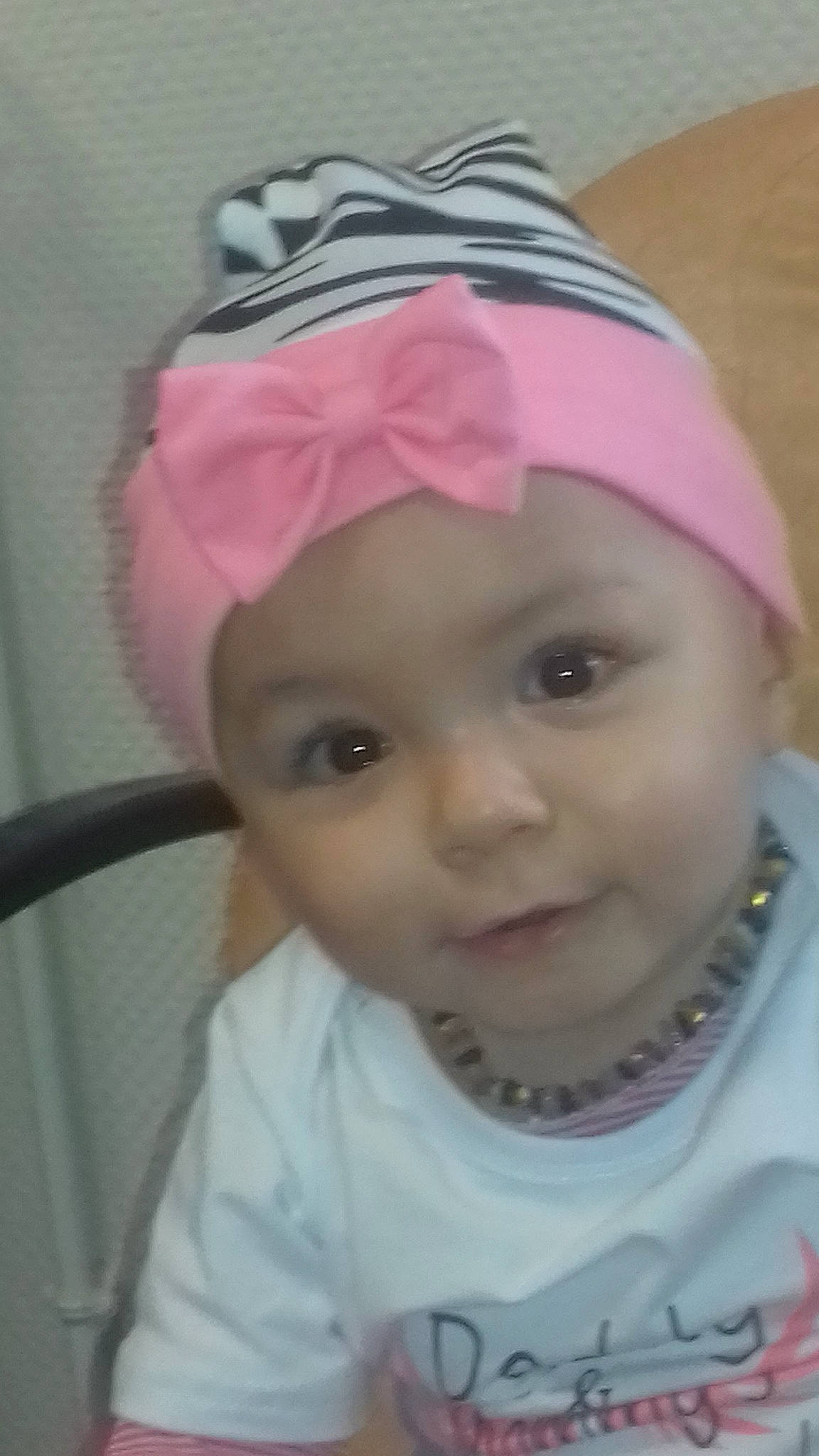 Maëlle a rejoint le concours — aidez-le/la à gagner de superbes lots ! baby, bonnet, cheek, child, clothing, fashion_accessory, forehead, hair_accessory, head, headgear, lip, person, pink, smile, toddler