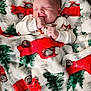 Nico joined the competition — help win amazing prizes! baby, blanket, child, comfort, cozy, cute, face, green_tree, hands, home, infant, peaceful, portrait, red_truck, resting, sleeping, smiling, soft, warm, white_clothing
