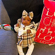 Jayonna is registered to the contest to win money with this photo: architecture, baby, clothing, costume, couch, cushion, doll, face, footwear, furniture, hat, head, homedecor, pants, person, photography, pillow, portrait, shoe, toy