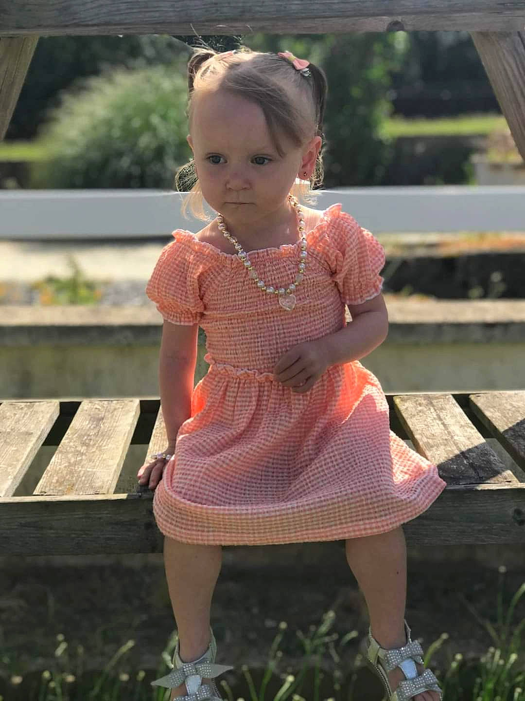 Faustine participe au concours pour gagner de l'argent avec cette photo : baby_toddler_clothing, beauty, day_dress, dress, face, formal_wear, grass, hairstyle, human_leg, leg, lip, one_piece_garment, pattern, person, pink, plant, sandal, summer, toddler, waist