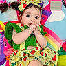 Melissia is registered to the contest to win money with this photo: baby, infant, child, colorful_clothing, headband, play_mat, rainbow, unicorn, bright_colors, cute, smiling, lying_down, footwear, white_shoes, bracelet, indoor, portrait, closeup, happy, eye_contact