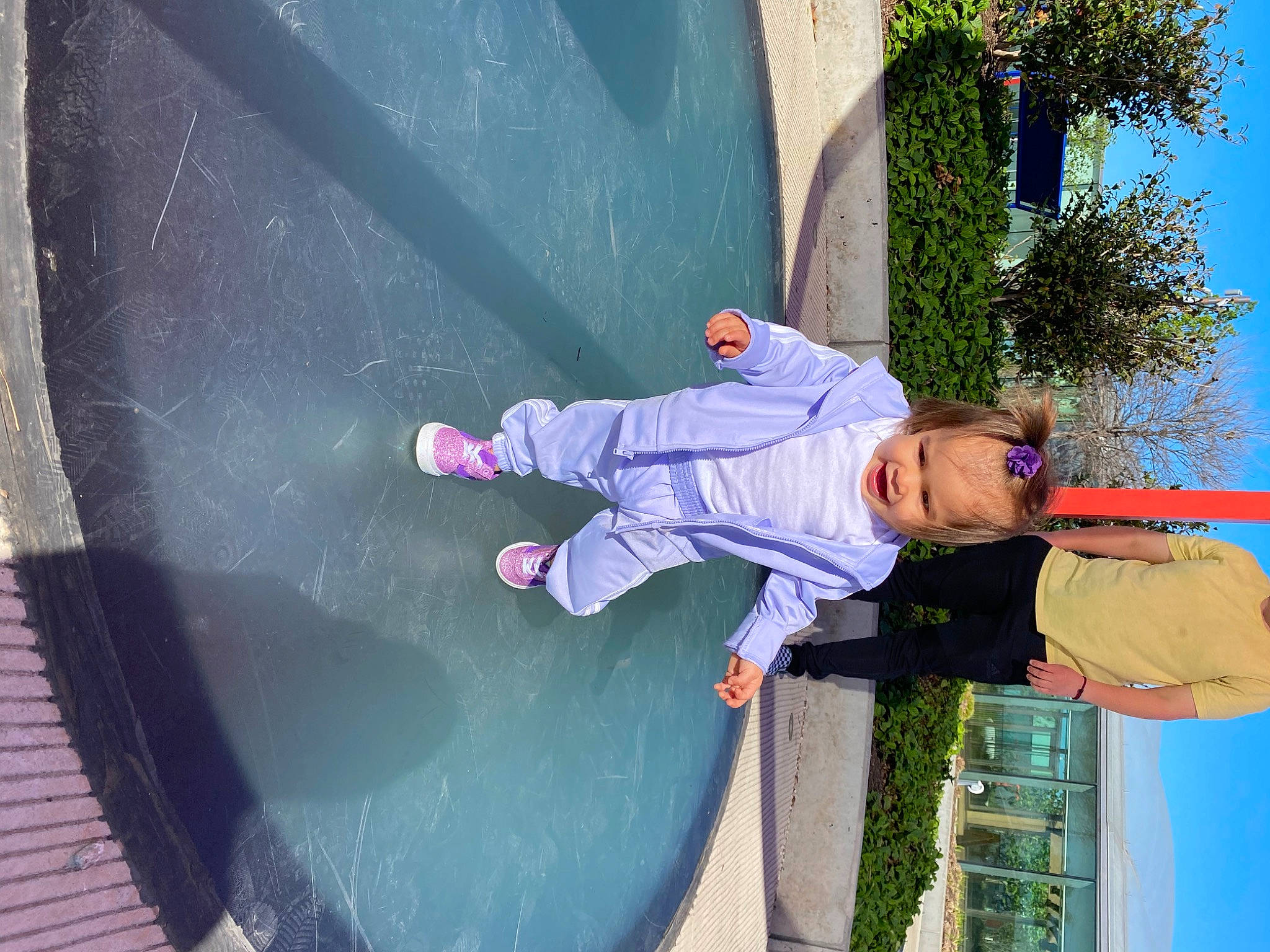 Meliana is registered to the contest to win money with this photo: asphalt, automotive_exterior, automotive_window_part, bumper, child, concrete, electric_blue, fun, leisure, person, plant, recreation, reflection, sky, toddler, tree, vehicle_door, walking_shoe, window