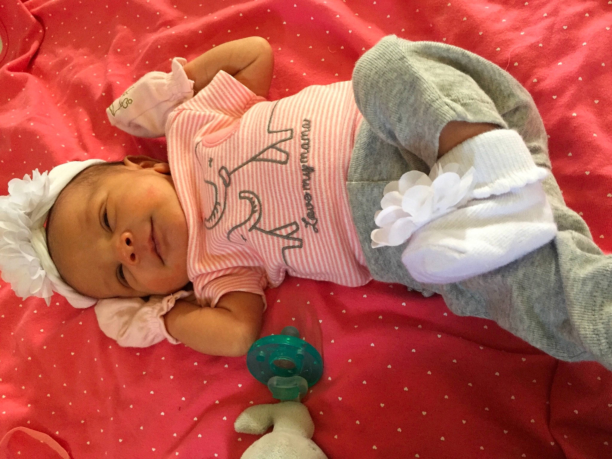 Jazlyn is registered to the contest to win money with this photo: baby, baby_products, baby_sleeping, baby_toddler_clothing, bedding, bedtime, cheek, child, comfort, finger, hand, human_body, lap, linens, person, pink, red, skin, sleeve, textile