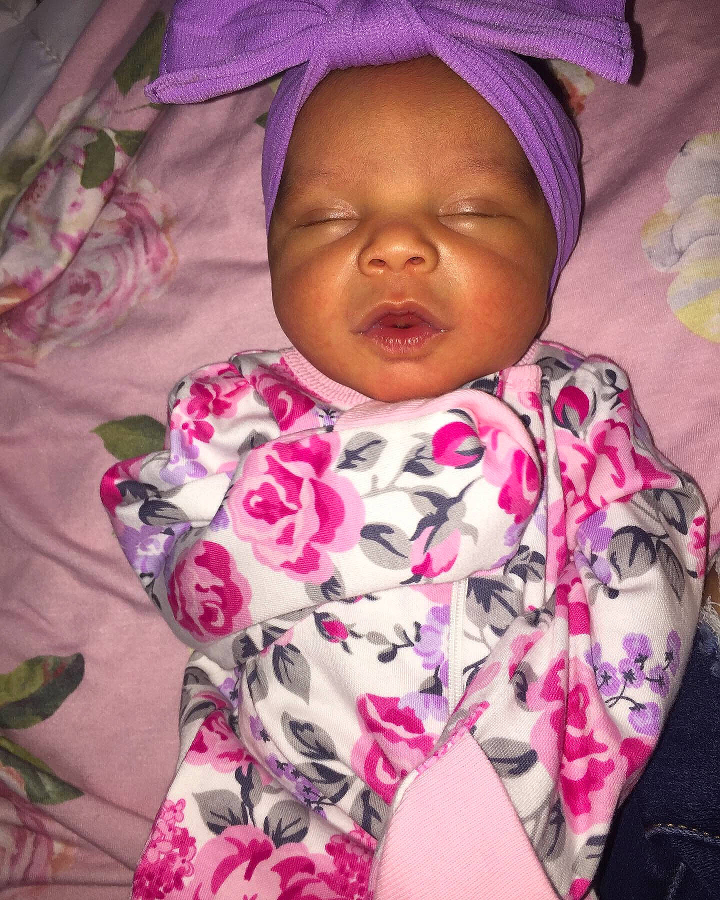 Jazlyn is registered to the contest to win money with this photo: arm, baby_sleeping, cheek, comfort, eyebrow, face, happy, head, human, lip, mouth, nose, organ, person, pink, purple, skin, sleeve, textile, violet