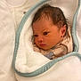 Eliana participe au concours pour gagner de l'argent avec cette photo : baby, newborn, infant, blanket, soft, wrapped, sleepwear, face, head, cute, child, indoors, newborn_clothing, portrait, young, resting, cozy, warm, peaceful, human