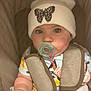 Violet joined the competition — help win amazing prizes! baby, pacifier, hat, butterfly, car_seat, child, infant, clothing, straps, cute, face, eyes, hand, sitting, comfort, soft, indoor, young, wearing, portrait