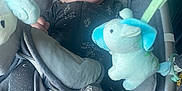 Finnick is registered to the contest to win money with this photo: baby, smile, infant, baby_seat, plush_toy, soft_toy, cushion, clothing, fabric, comfort, child, indoors, seat, baby_clothes, toy, person, cute, young_child, happy, portrait