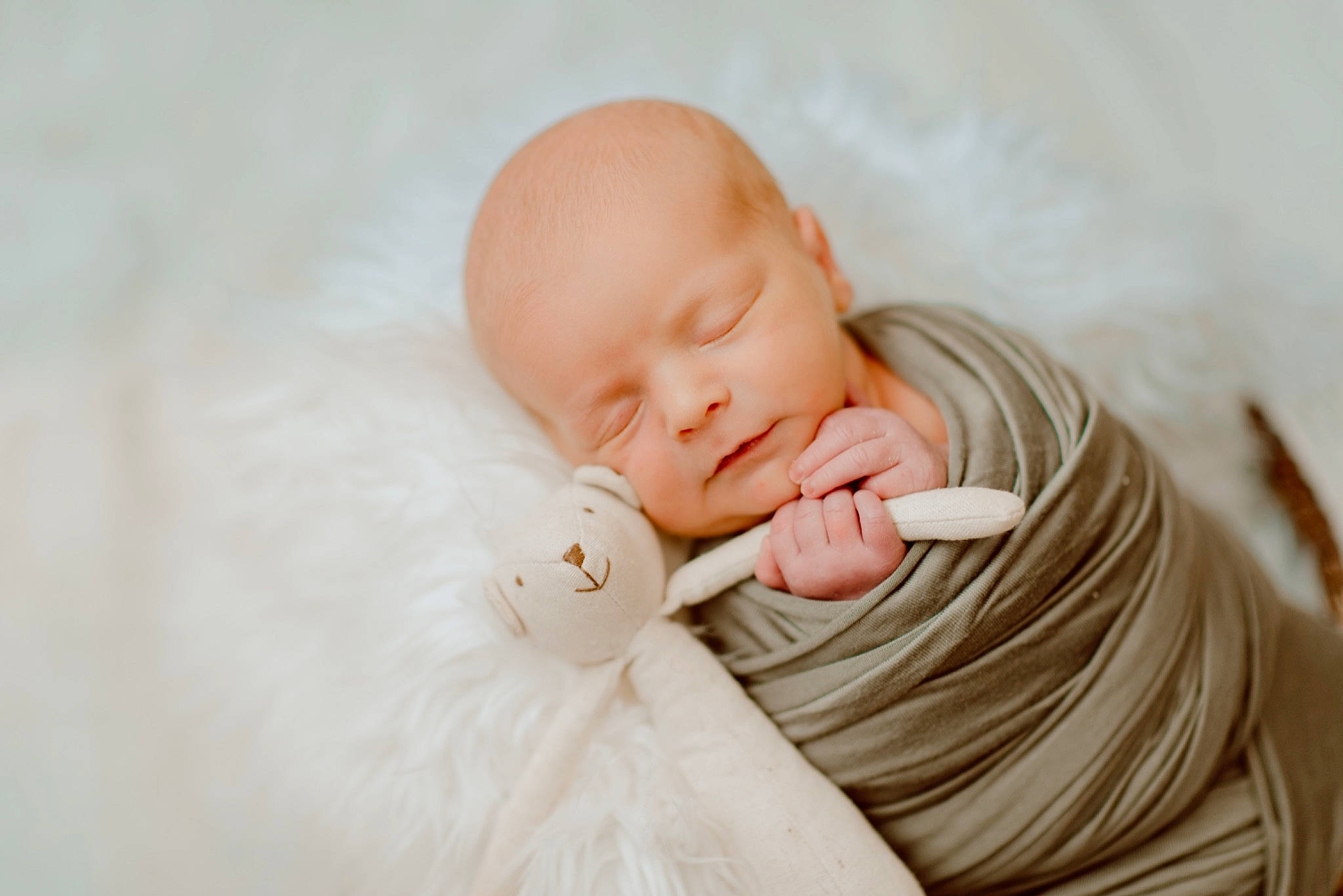 Rowan is registered to the contest to win money with this photo: baby, baby_toddler_clothing, cheek, child, comfort, finger, fur, gesture, hand, happy, linens, nail, peach, person, portrait_photography, sitting, skin, sleeve, thumb, toddler